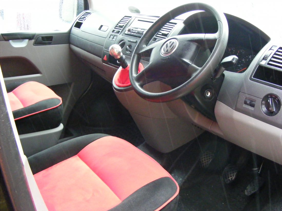 re upholstered in red and black faux suade