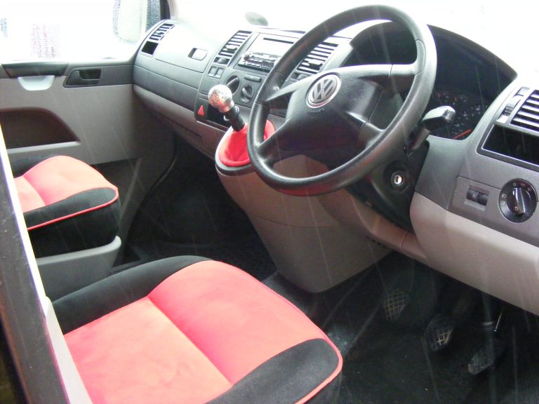 re upholstered in red and black faux suade