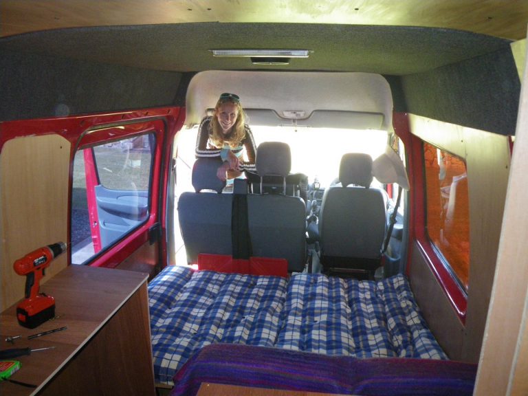 Bed extended, with kitchen counter on far left.